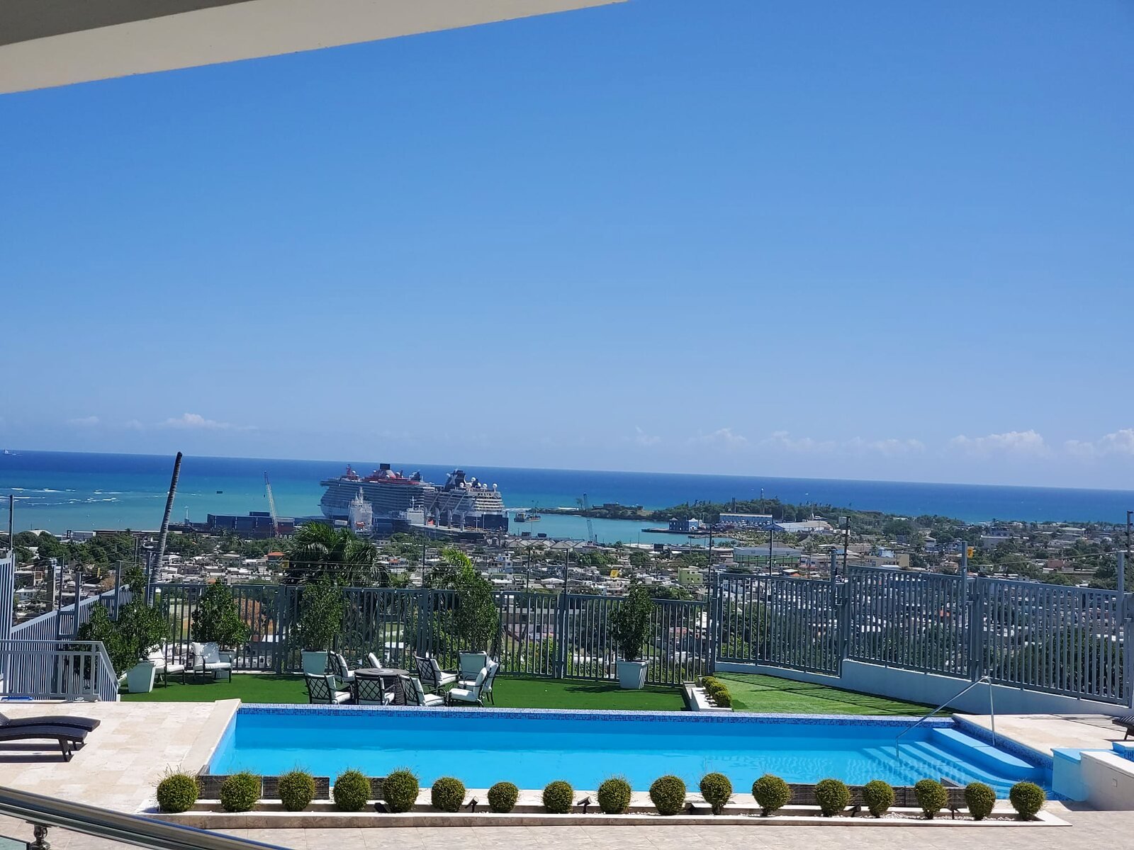 Cruise ship docked in Puerto Plata port, seen from the villa's infinity pool